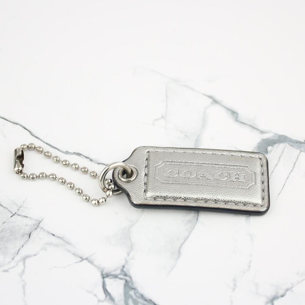 Coach Silver Leather Embossed Logo Hangtag